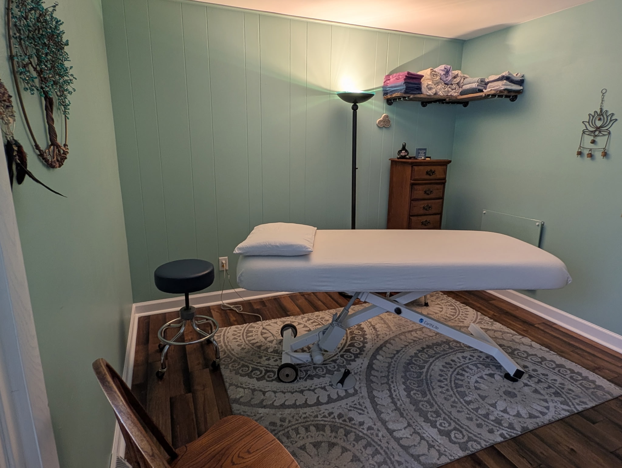 A picture of a massage bed in a private treatment room